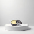 Cosmetigo.be Gummy Professional Beard & Moustache Balm in a black tin, yellow balm inside, for styling and hydration.