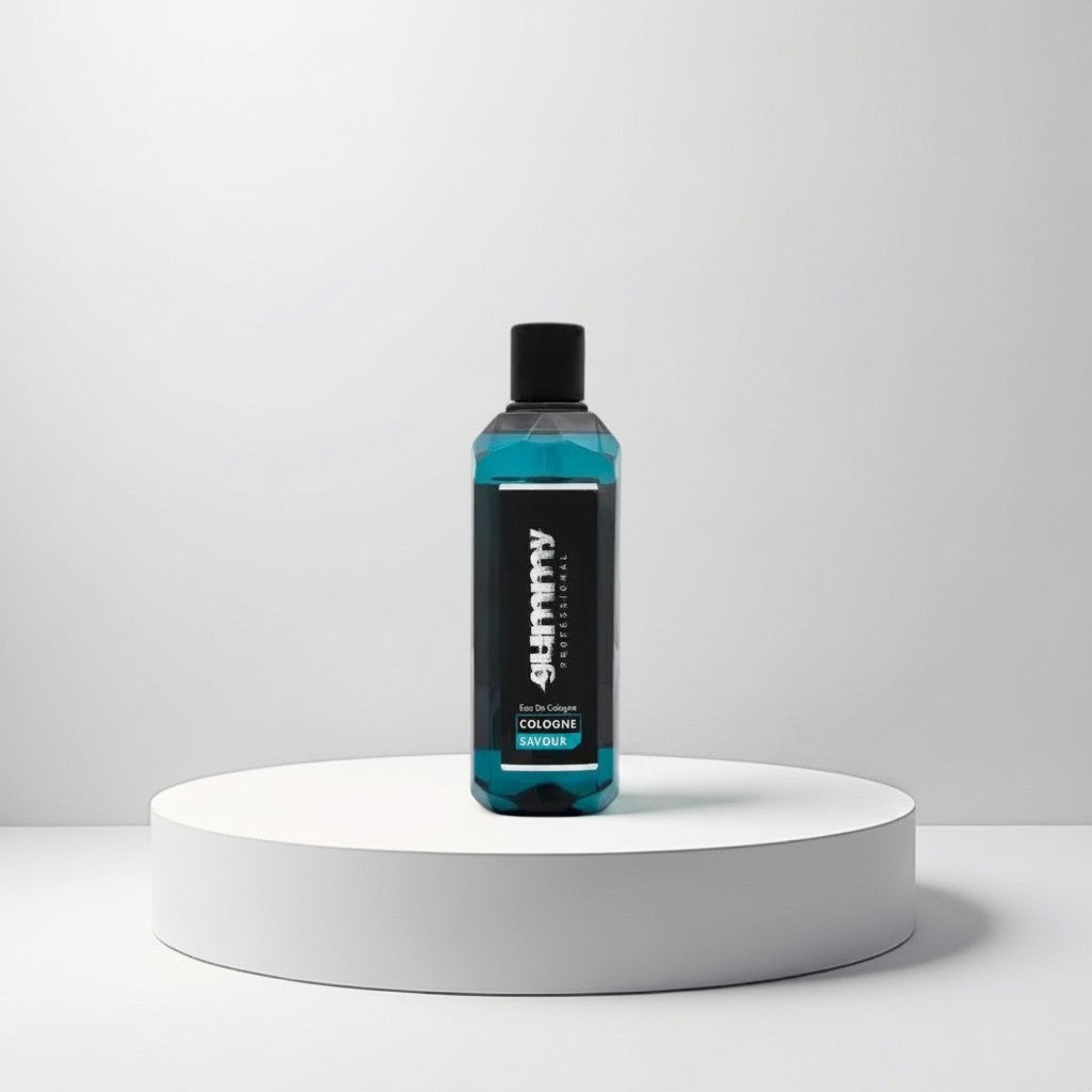 Gummy Professional Eau De Cologne Savour in a clear bottle with blue liquid, presented on a white pedestal.