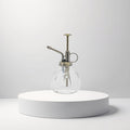 Cosmetigo.be vintage glass barber water sprayer with copper pump and ribbed design, 200ml capacity.