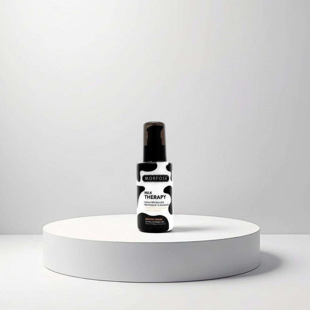 cosmetigo.be Morfose Milk Therapy Keratine Serum in a black and white cow print bottle with pump dispenser.