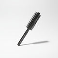 Cosmetigo.be rodeo Gentleman 7005 small diameter round brush with black bristles and handle, ideal for styling short hair and adding volume.